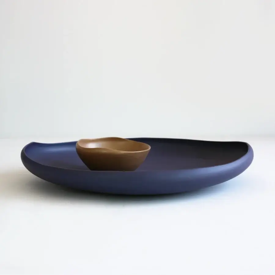 Superior Rina Menardi Laguna centerpiece crafted in baked clay with indigo blue and muted brown hues plus a matte finish