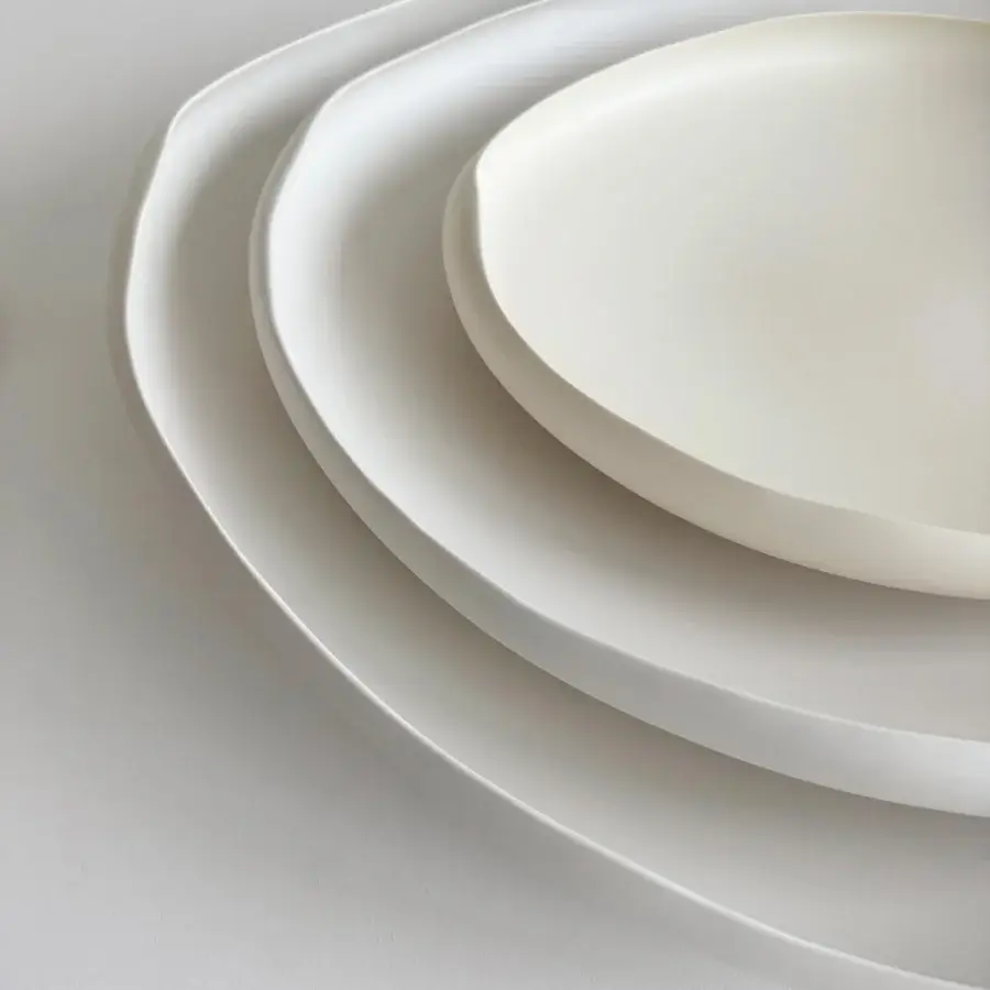 Distinguished Rina Menardi Laguna centerpiece crafted in baked clay with softly curved silhouettes and matte finish