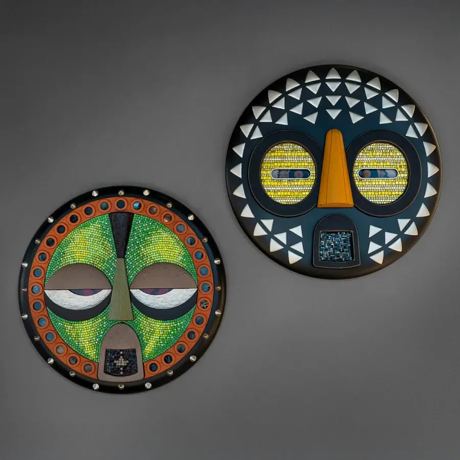 Captivating Sicis Mask Capsule Collection mask with navy blue background and vibrant yellow mosaic face crafted in natural wood and Vetrite glass