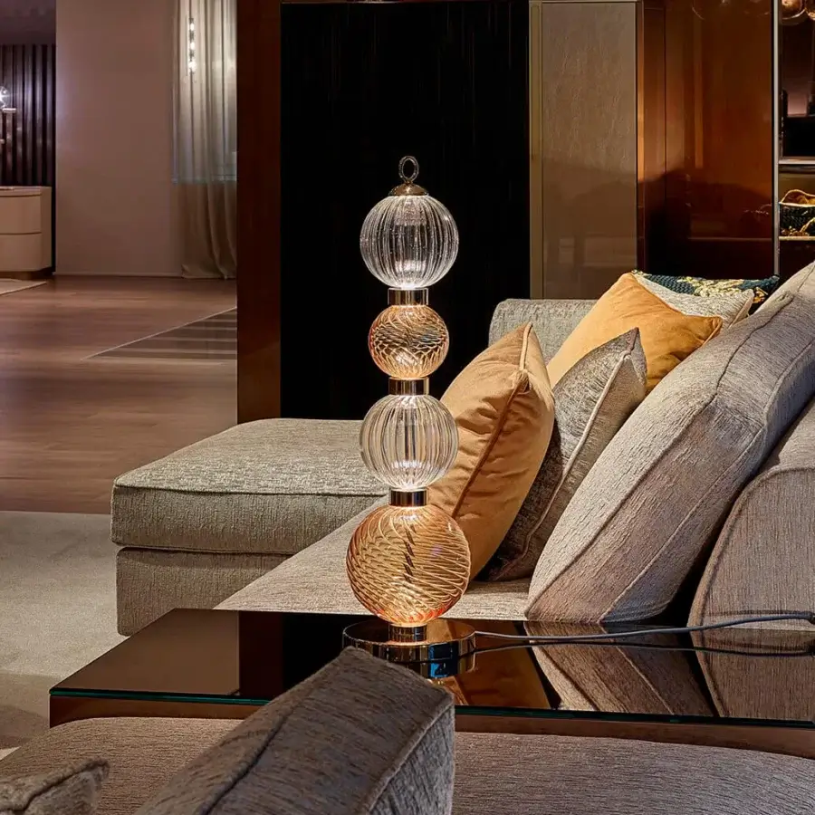 Superior Sicis Drop table lamp crafted in amber and clear pyrex glass with a satin-finished metal frame