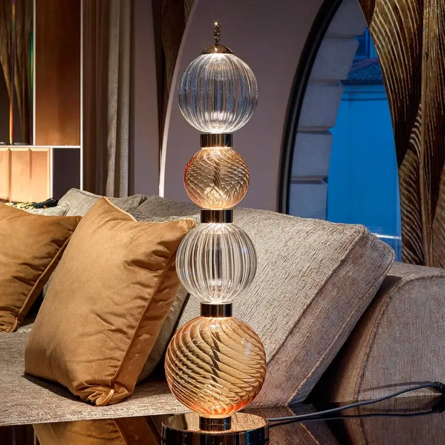 Elegant Sicis Drop table lamp crafted in clear and amber pyrex glass with a satin-finished metal frame