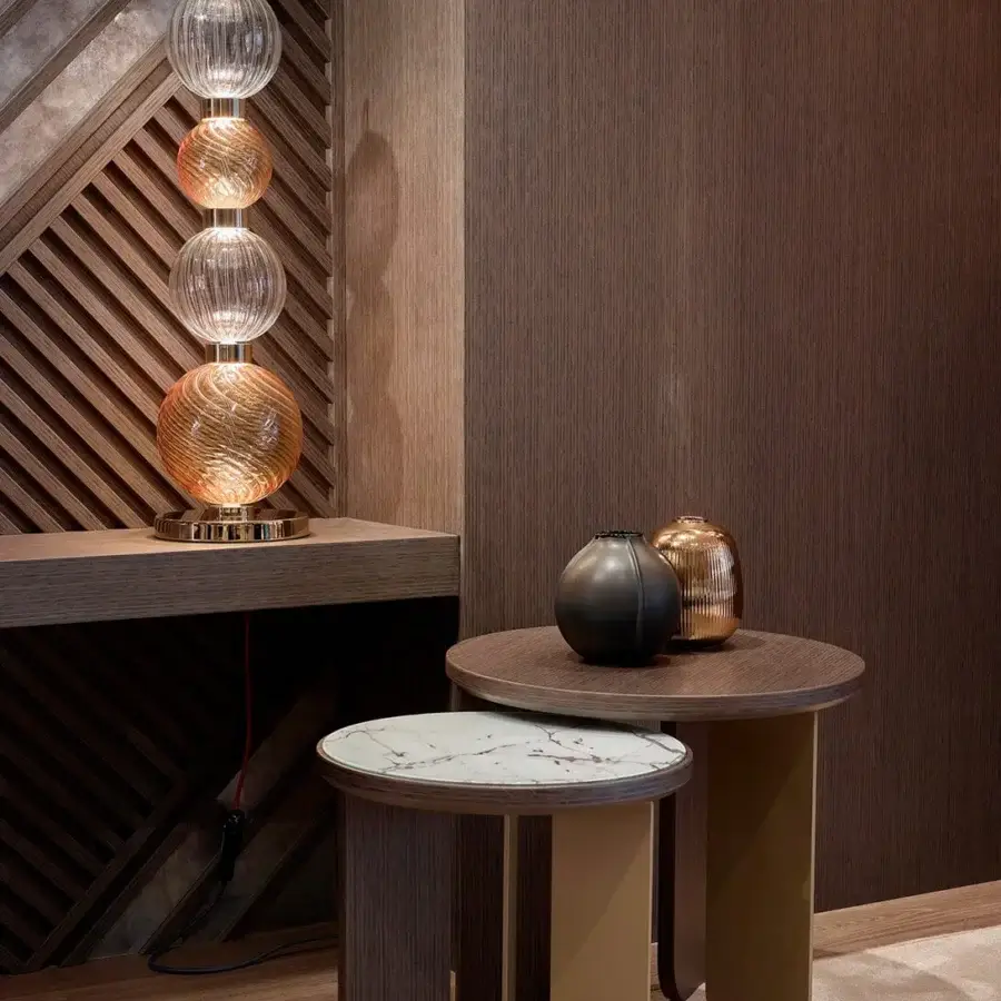 Elegant Sicis Drop table lamp crafted in pyrex glass with a satin-finished metal frame and warm amber shades