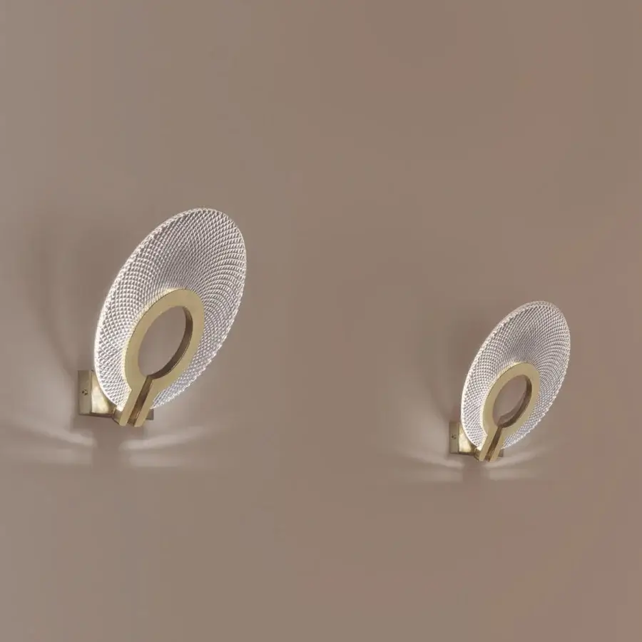 Distinctive Euroluce Corallo wall lamp with a delicate oval silhouette and hand-ground satin gold finish radiating soft brilliance