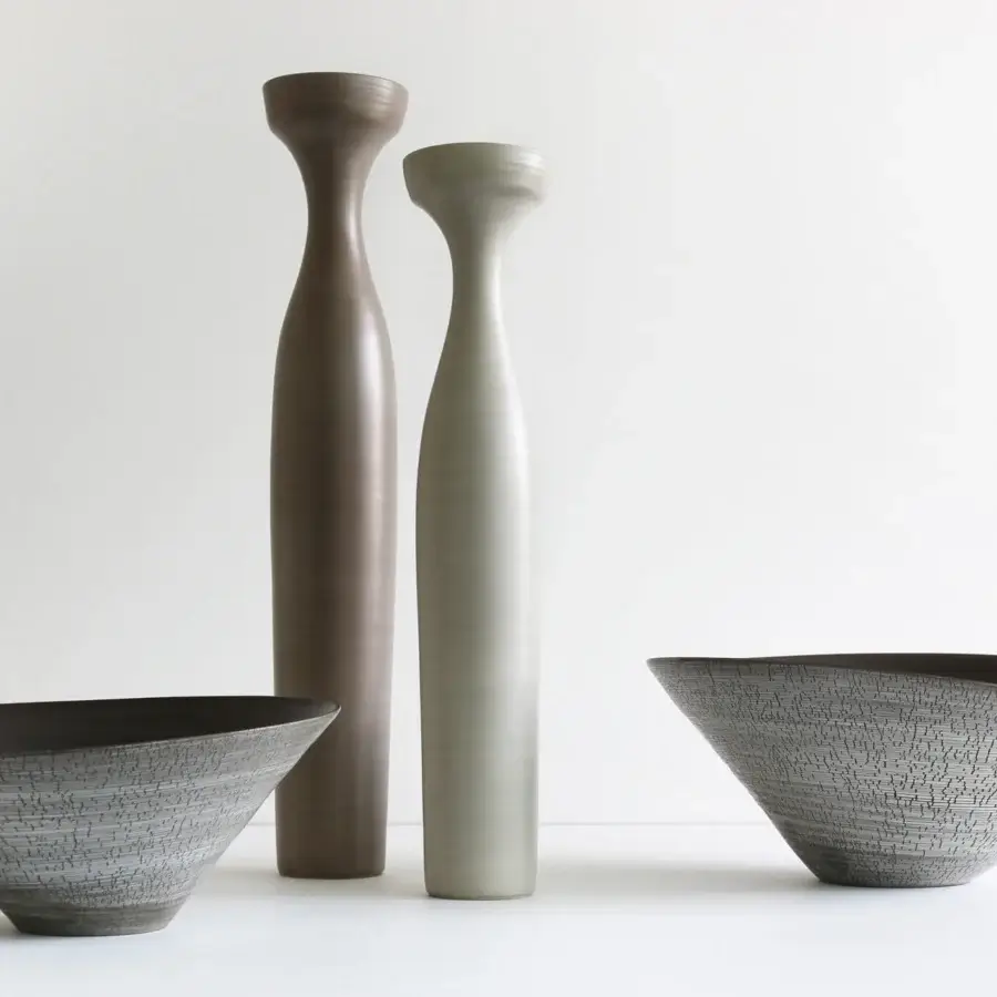 Distinguished Rina Menardi Angeli vase crafted from baked clay in a brownish-grey tone with a textured matte finish