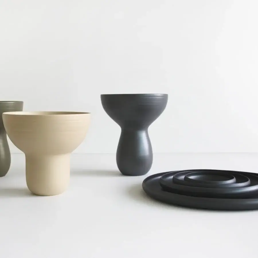 Distinguished Rina Menardi Bouquet vessel crafted in baked clay with an hourglass silhouette and matte finish