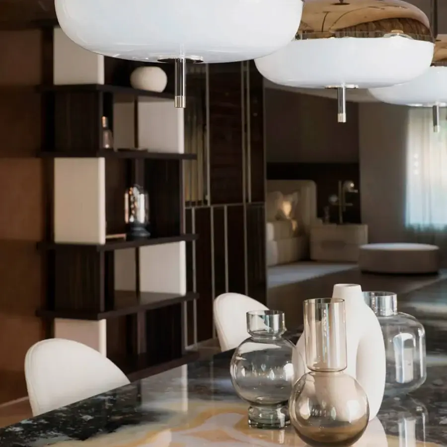 Lavish Sicis Amaretto suspension lamp crafted in metal with polished black nickel and champagne finish, plus white opal blown glass diffuser