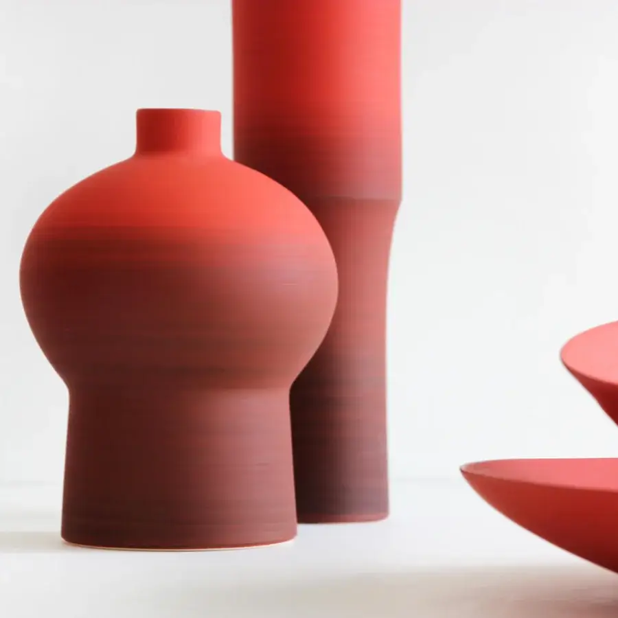 Distinguished Rina Menardi Royal vase crafted from baked clay in a deep red hue with a textured matte finish