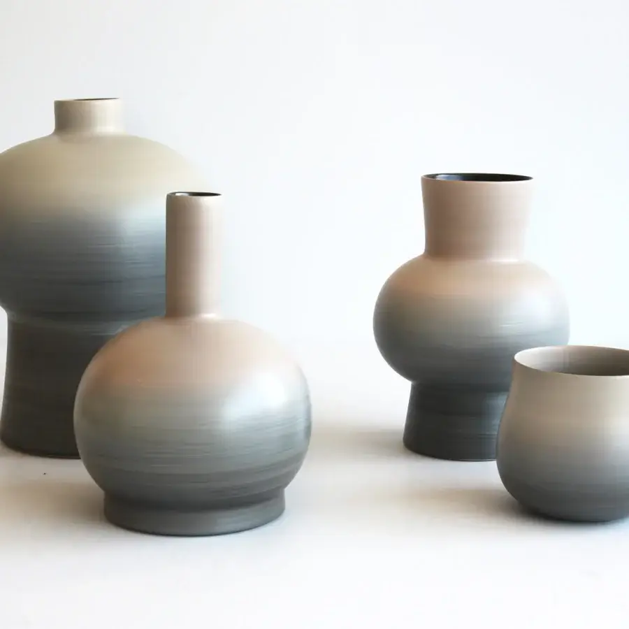 Exclusive Rina Menardi Royal vase crafted from baked clay with a subtle ombre transitioning from beige to charcoal gray