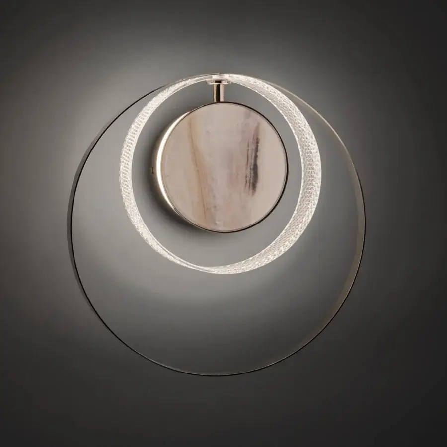 Exceptional Euroluce Eclissi wall lamp crafted with polished metal rings and a satin-finished wooden disc exhibiting a hand-cut diamond effect