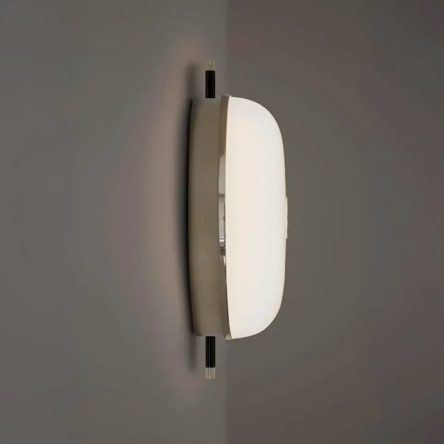 Elegant Sicis Amaretto wall lamp crafted in metal with polished black nickel and champagne finishes plus a neutral beige body