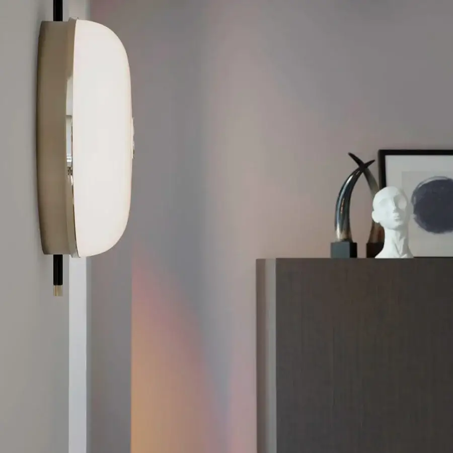 Distinguished Sicis Amaretto wall lamp crafted in metal with polished black nickel and champagne finish, plus milky white blown glass