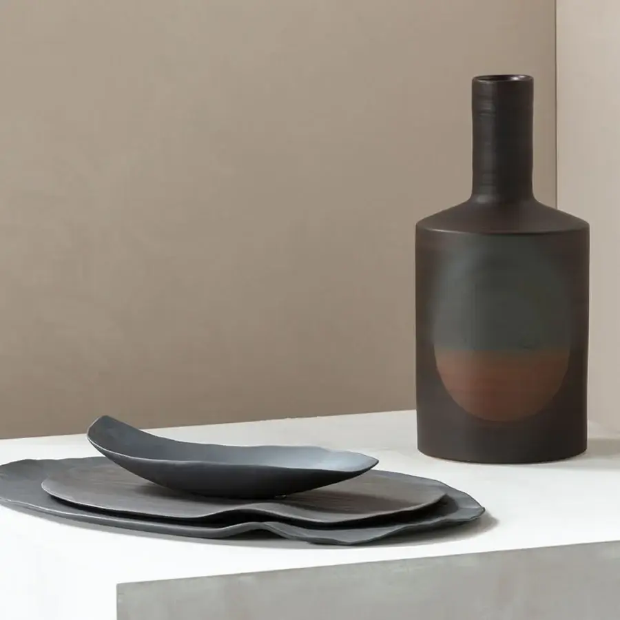 Exclusive Rina Menardi Oblo' vase sculpted from baked clay with a gradient from charcoal gray to reddish-brown and a subtly textured matte surface