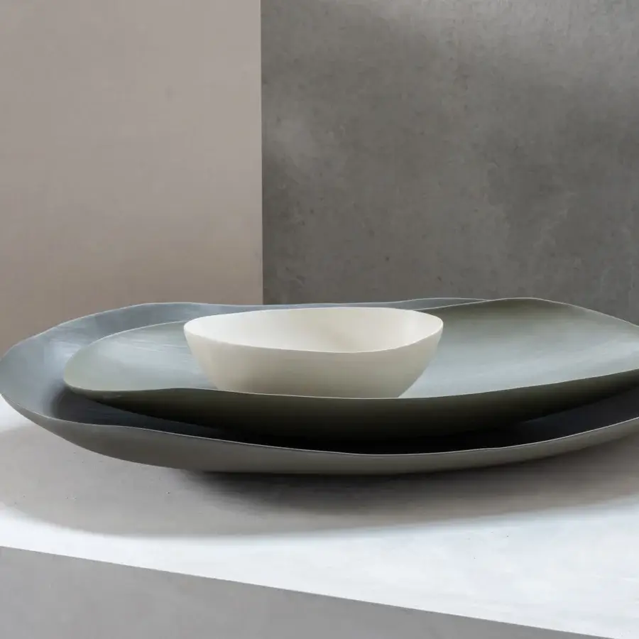Exclusive Rina Menardi Petali centerpiece crafted in baked clay with a flowing arrangement and subtly textured matte finish