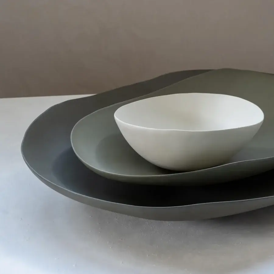 Distinguished Rina Menardi Petali centerpiece crafted in baked clay with a matte grayish-green finish and undulating asymmetrical forms