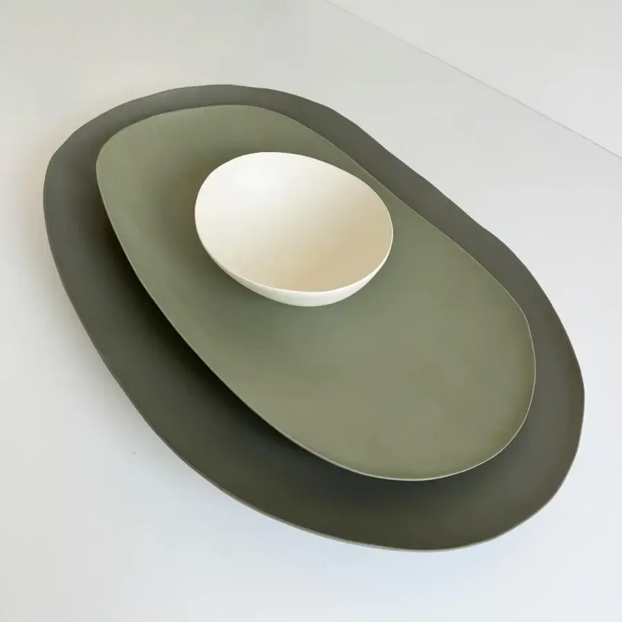 Exceptional Rina Menardi Petali centerpiece crafted from baked clay in graduated green shades with an off-white bowl
