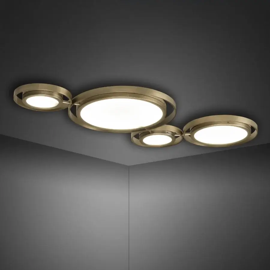 Cassoni girasole ceiling lamp, brushed brass finish, circular design with central light and four offset elements, diffused white illumination.
