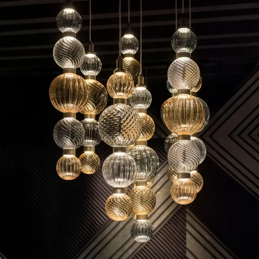 Distinguished Sicis Drop suspension lamp crafted in amber and clear hand-blown Pyrex glass with a satin metal frame