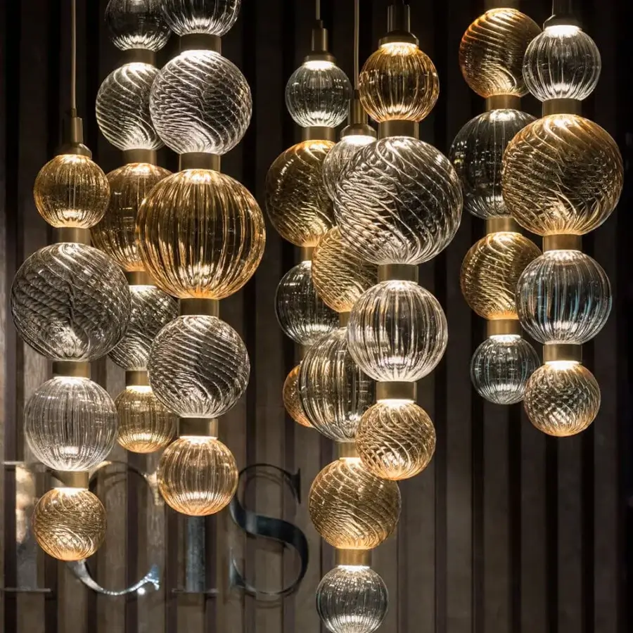Exceptional Sicis Drop suspension lamp crafted in clear glass with golden and silver reflections and satin brass-toned metal frames