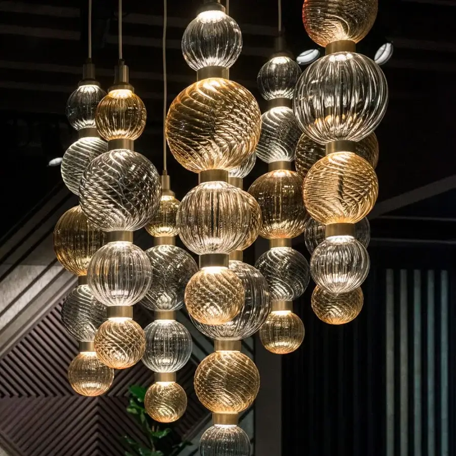 Lavish Sicis Drop suspension lamp crafted in glass with golden and silver-toned metal frames and satin finish