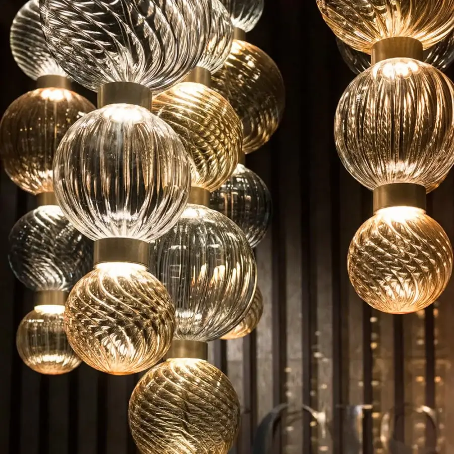 Distinguished Sicis Drop suspension lamp with hand-blown Pyrex glass spheres and radiant golden metal frames in polished satin finish