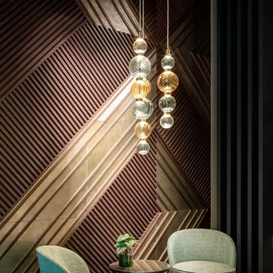 Distinguished Sicis Drop suspension lamp with hand-blown Pyrex glass spheres in amber, clear, and rose tones with satin-finished metal frames