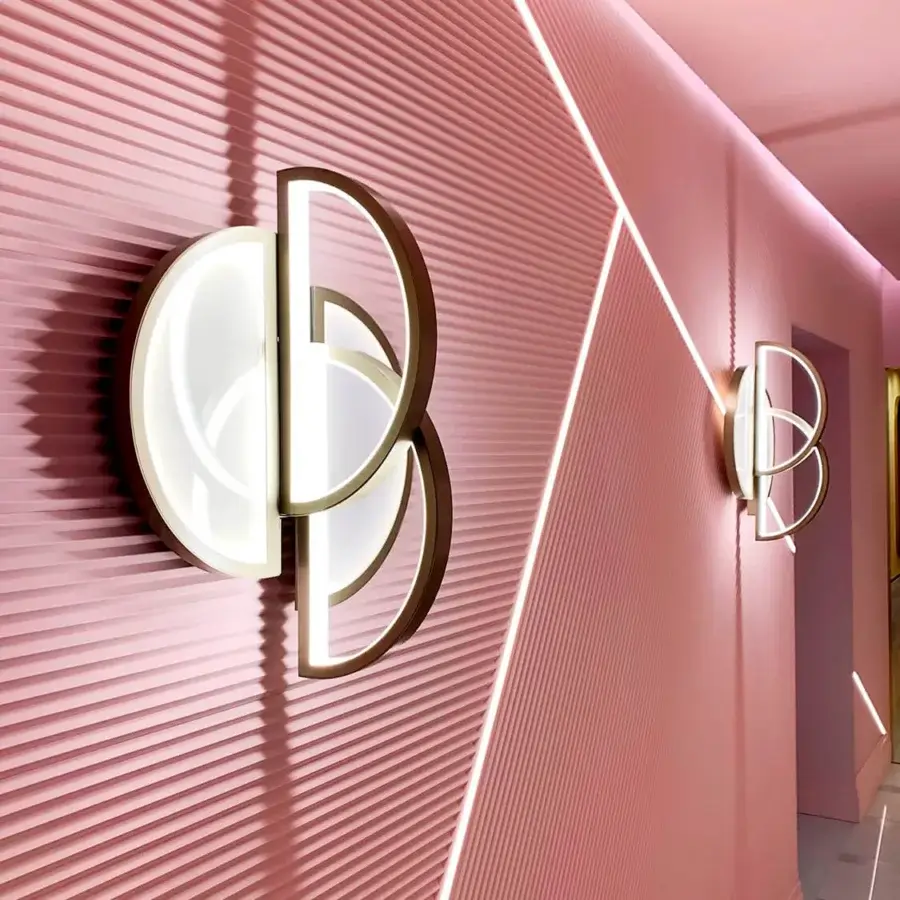 Luxury Sicis Venus wall lamp with a refined brass structure and luminous backlit Vetrite glass in champagne finish