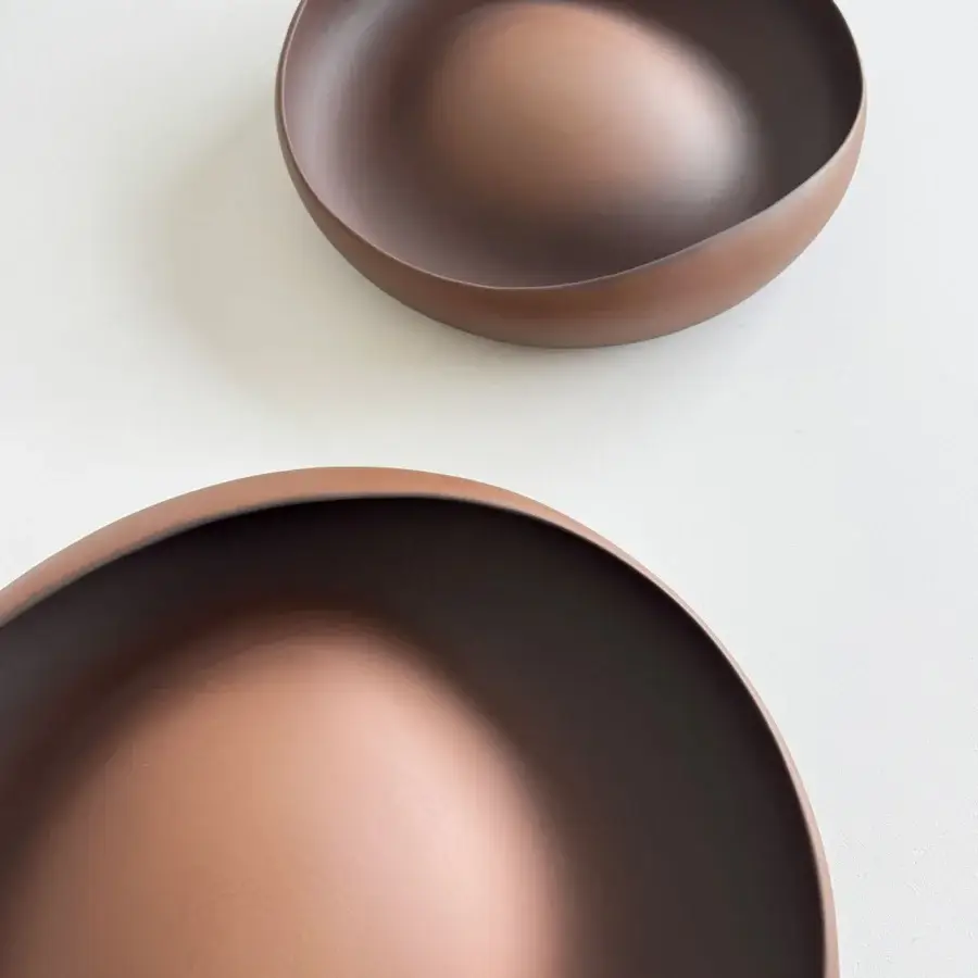 Exclusive Rina Menardi Ellissi centerpiece crafted in muted brownish-red baked clay with a smooth matte finish