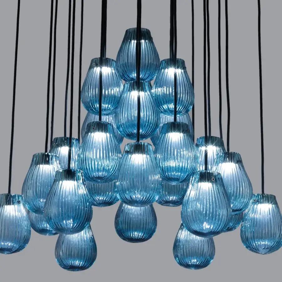 Exceptional Euroluce Gocce suspension lamp crafted in translucent blue hand-blown glass with a textured ribbed surface