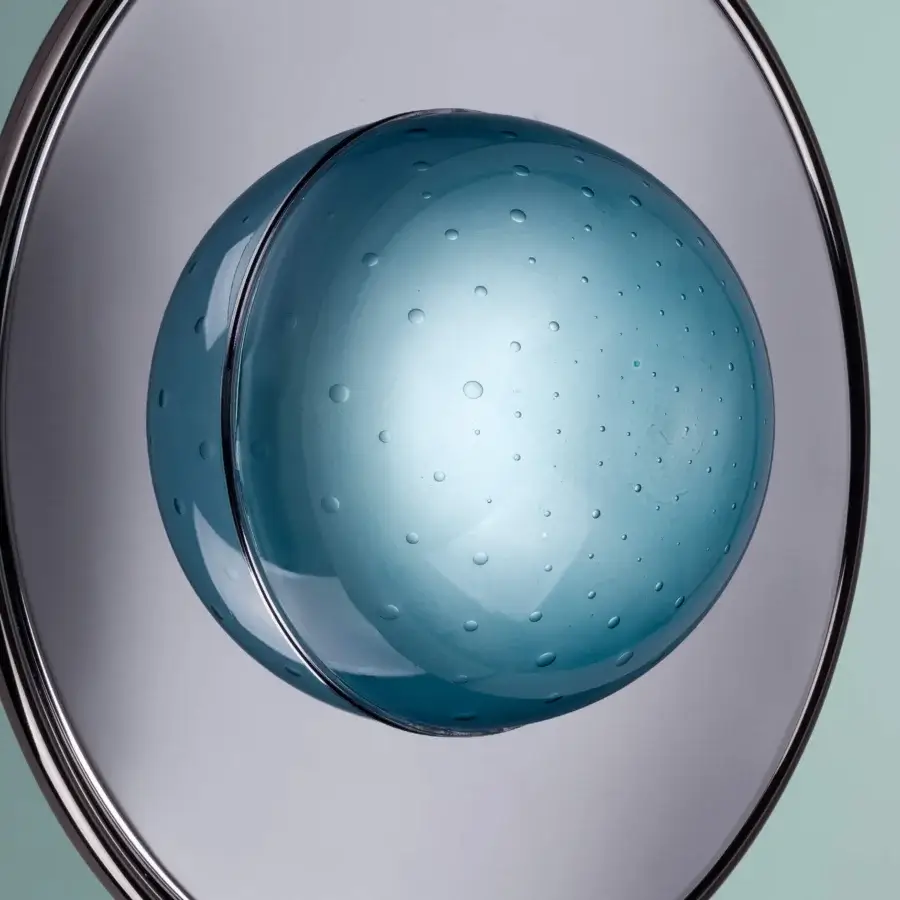 Superior Euroluce Illusione wall lamp crafted in mirrored chrome with a teal glass half-sphere creating a luminous optical illusion