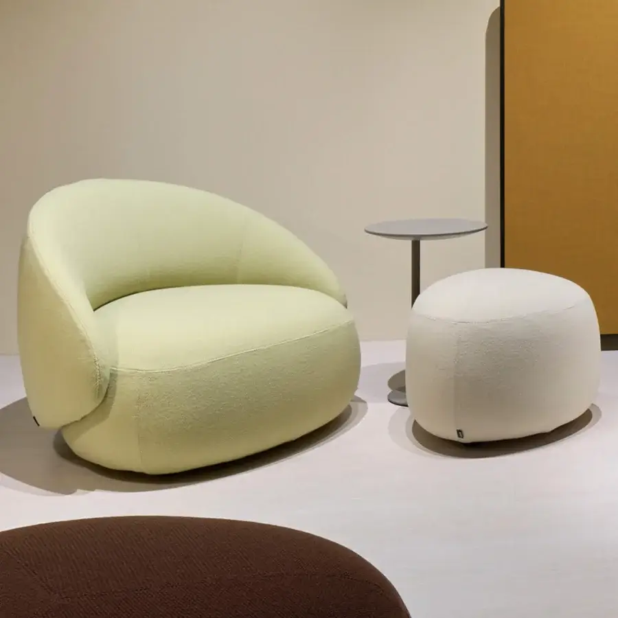 Distinguished Lapalma Kipu Club lounge chair upholstered in pale green bouclé weave with an ergonomic backrest crafted in Italy
