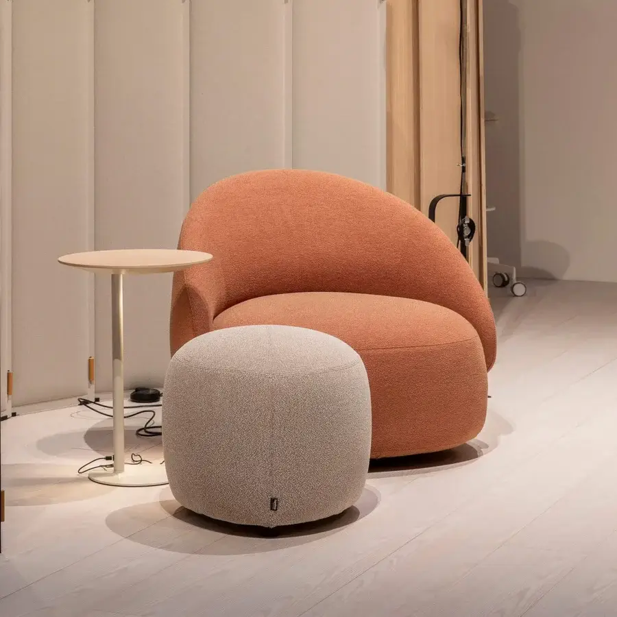 Sophisticated Lapalma Kipu Club lounge chair with a rounded terracotta form upholstered in textured woven fabric