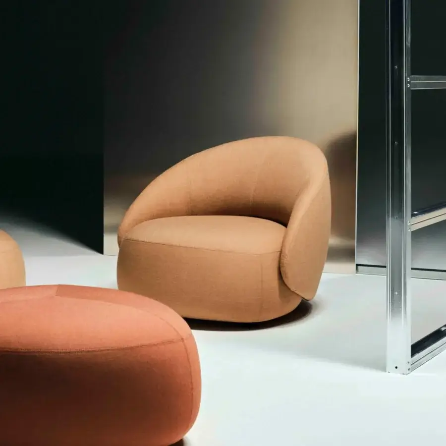 Lavish Lapalma Kipu Club lounge chair with sculpted form upholstered in textured terracotta textile and matte finish