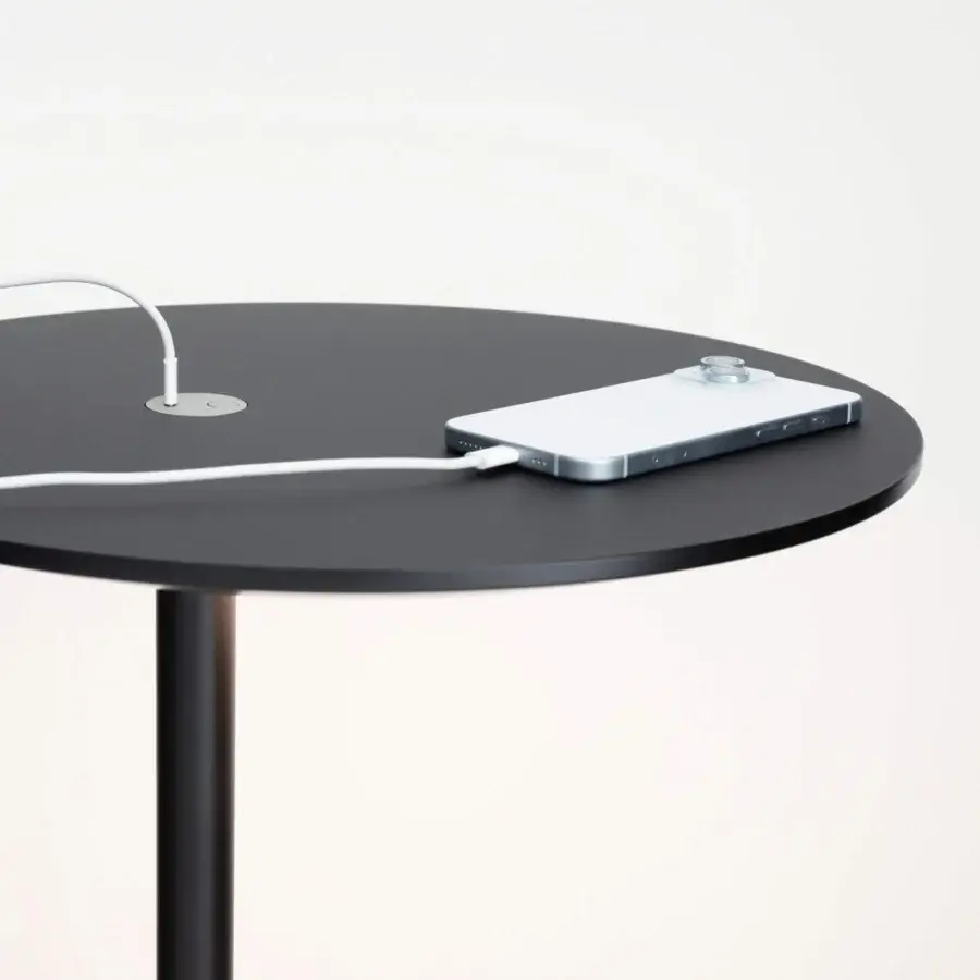 Distinguished Lapalma LYT side table with dark matte tabletop and cylindrical pedestal built with integrated USB-C port and LED light