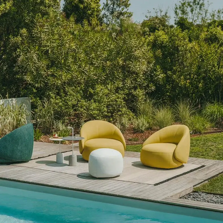 Sophisticated Lapalma Kipu Club lounge chair in muted yellow with subtly textured textile upholstery and ergonomic backrest