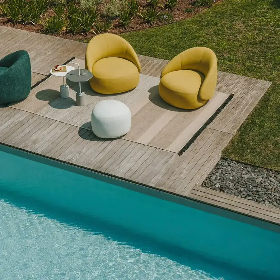 Elegant Lapalma Kipu Club lounge chair in vibrant yellow textile upholstery with organically curved form