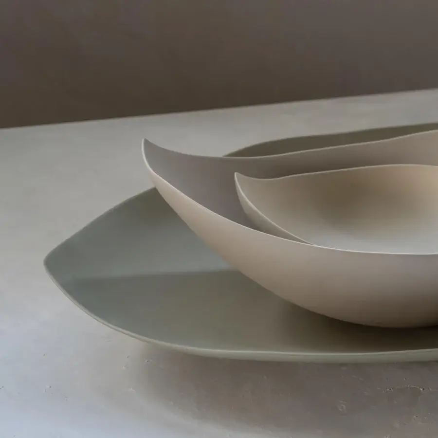 Distinguished Rina Menardi Barchette centerpiece crafted in baked clay with a smooth matte finish and tonal variations