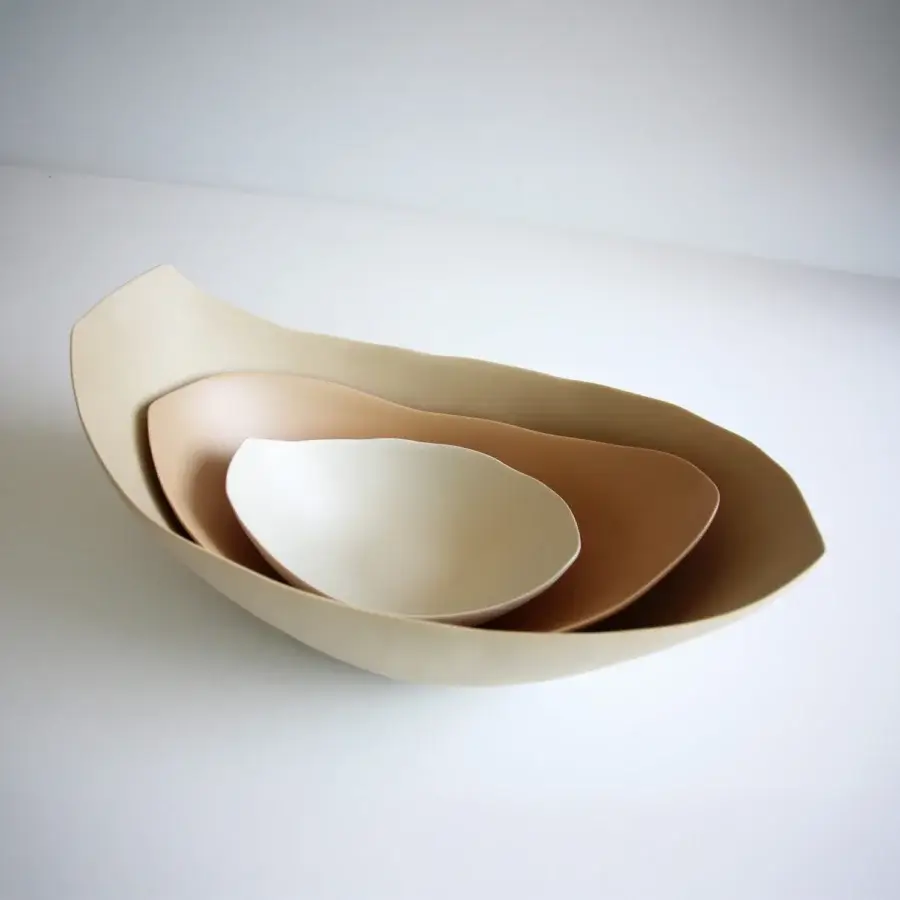 Exceptional Rina Menardi Barchette centerpiece crafted in baked clay with a smooth matte surface and warm neutral gradient