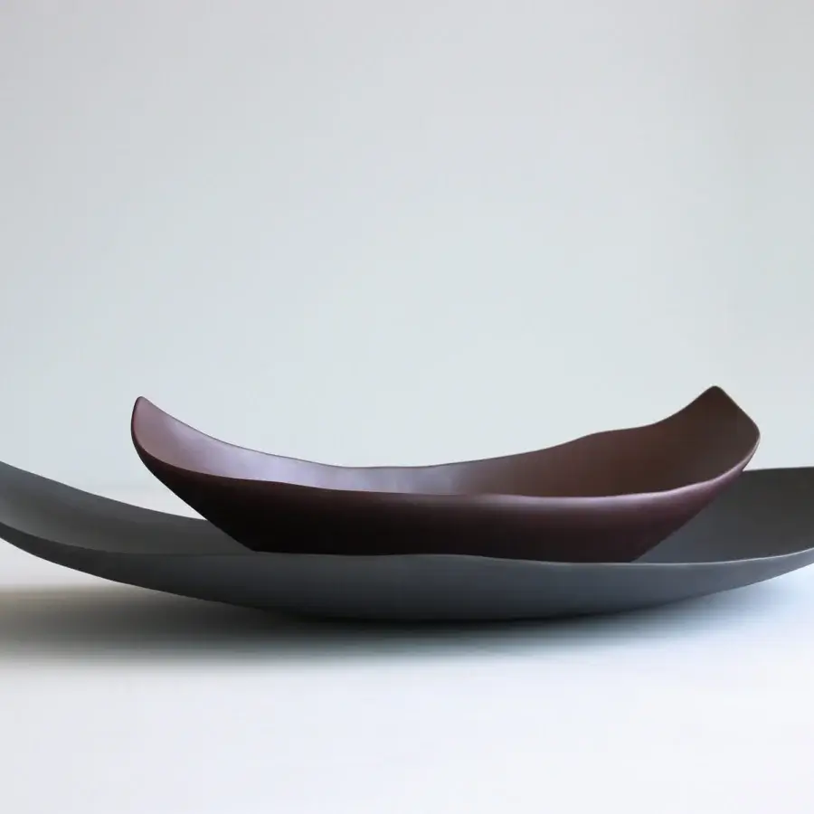 Superior Rina Menardi Barchette centerpiece crafted in baked clay with flowing asymmetrical forms and gradient gray-brown tones
