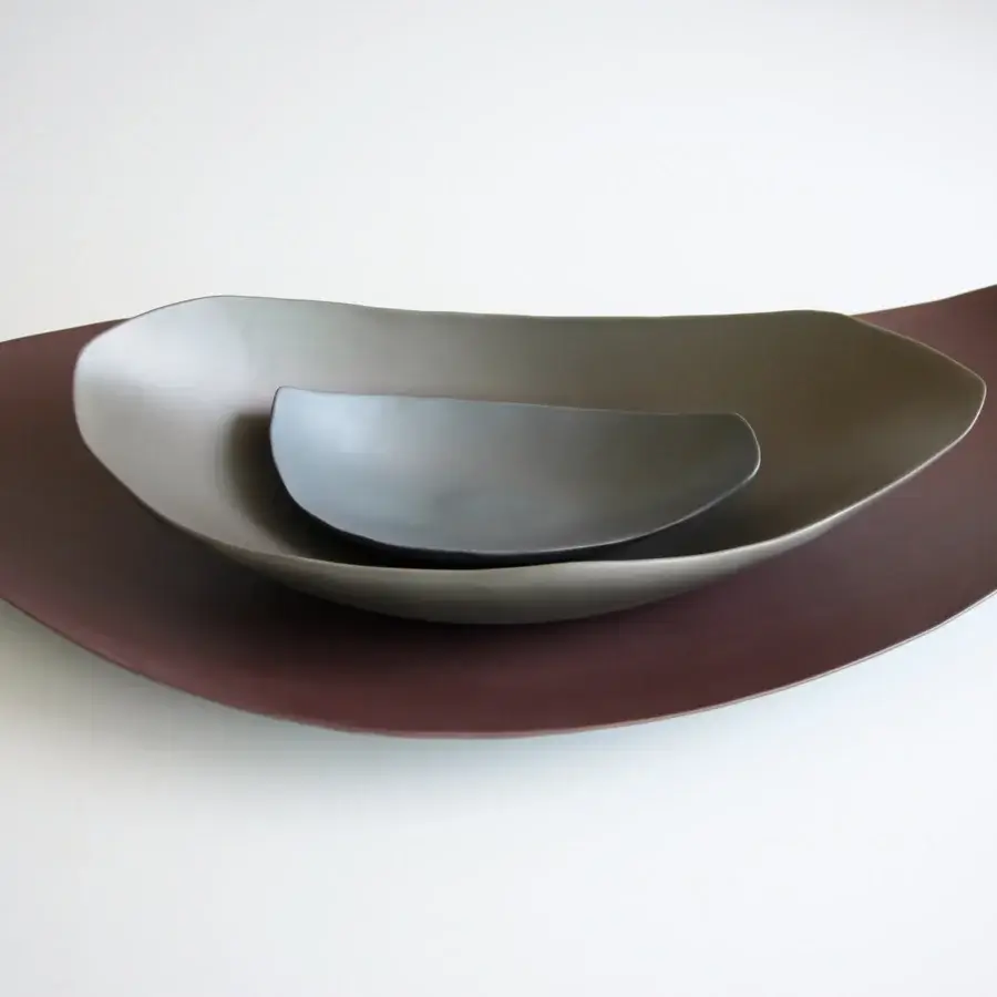 Distinguished Rina Menardi Barchette centerpiece crafted in baked clay with layered silver-toned to brownish-gray shades and matte finish