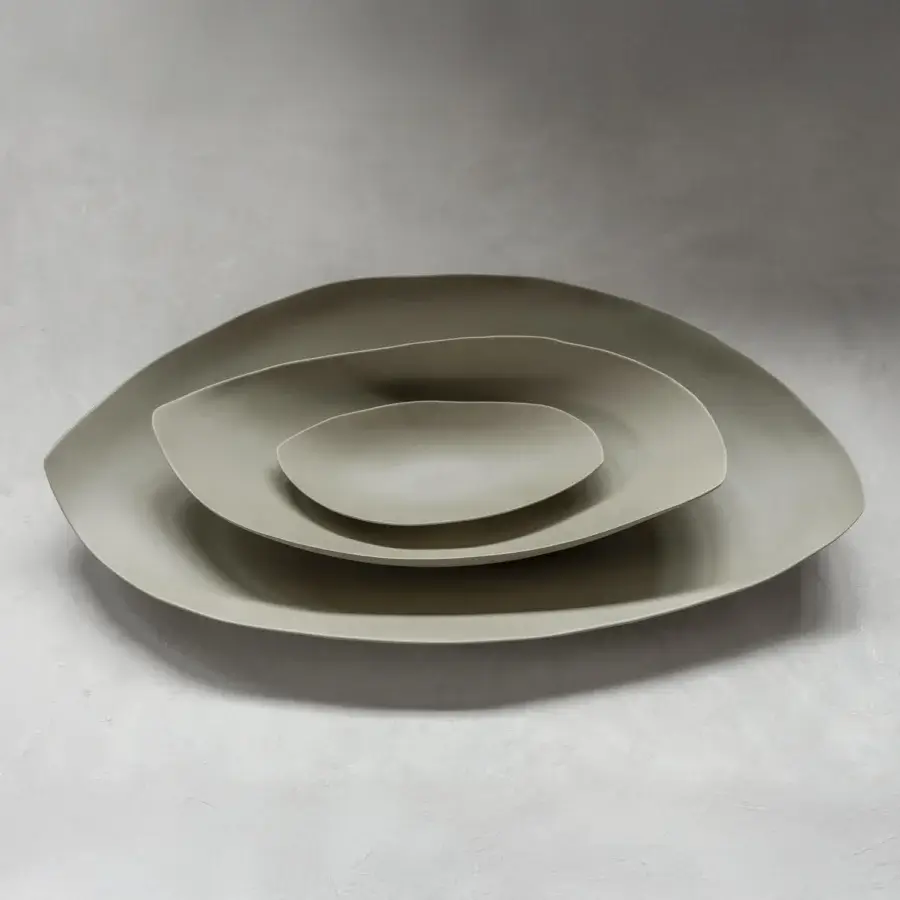 Superior Rina Menardi Barchette centerpiece crafted in baked clay with undulating edges and warm gray finish