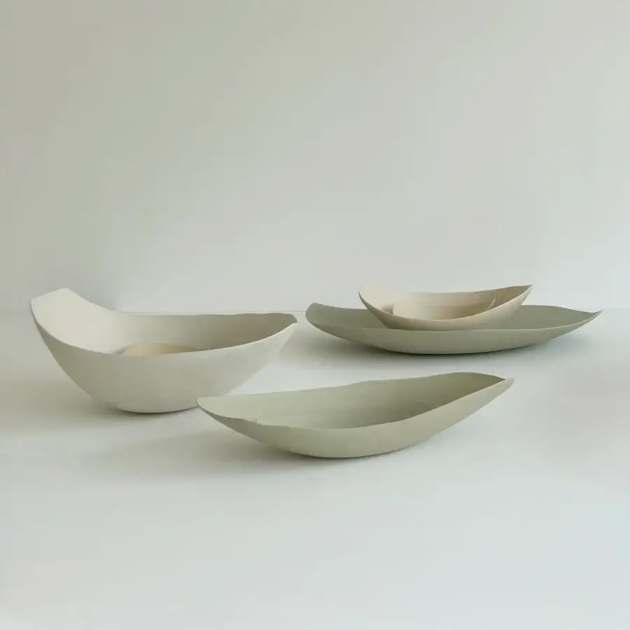 Distinguished Rina Menardi Barchette centerpiece crafted in baked clay with an asymmetrical form and smooth matte finish