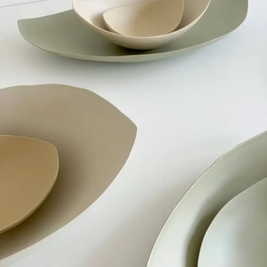 Exclusive Rina Menardi Barchette centerpiece crafted in baked clay with organic boat-like forms and a subtle tonal gradient effect