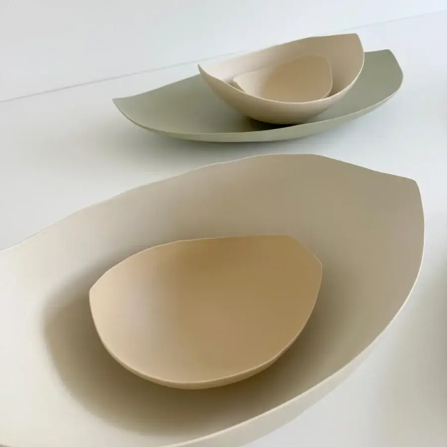 Exceptional Rina Menardi Barchette centerpiece crafted in baked clay with pale sage green and warm beige hues, displaying a matte finish