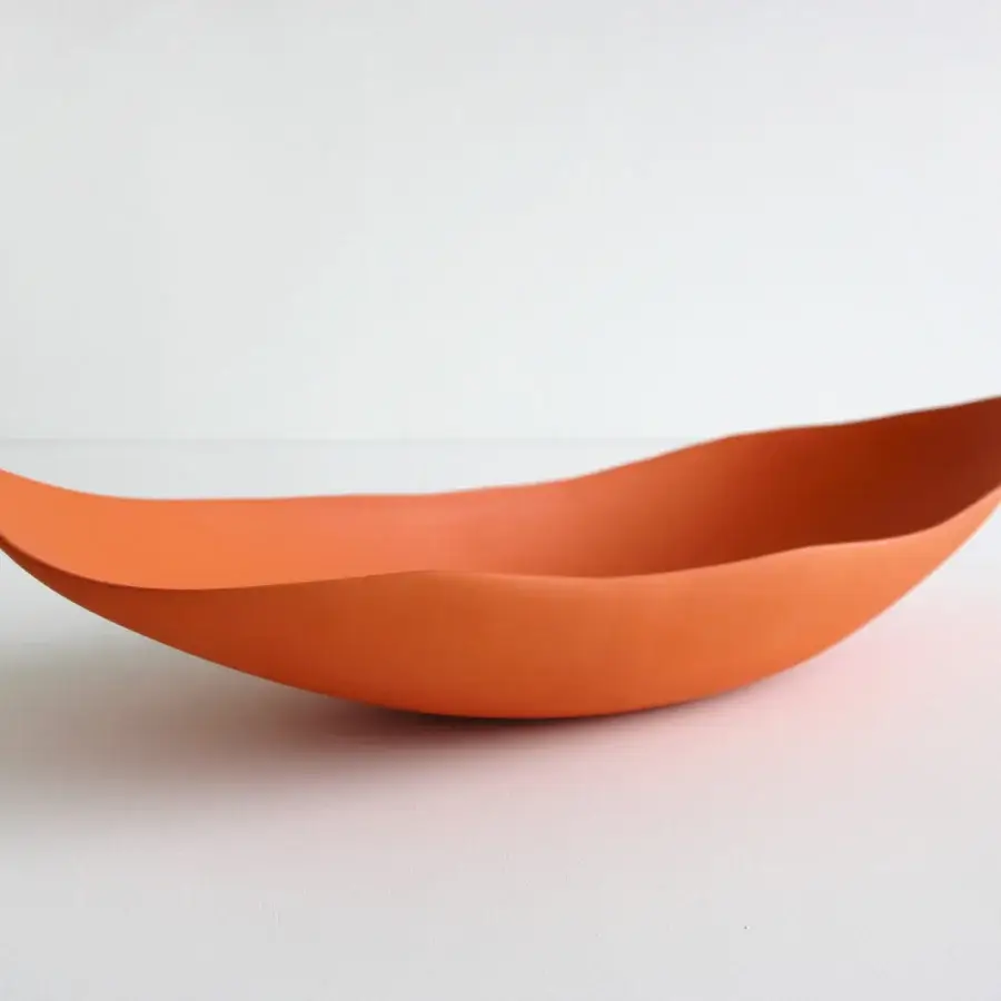 Superior Rina Menardi Barchette centerpiece crafted in baked clay with a smooth warm orange flowing form