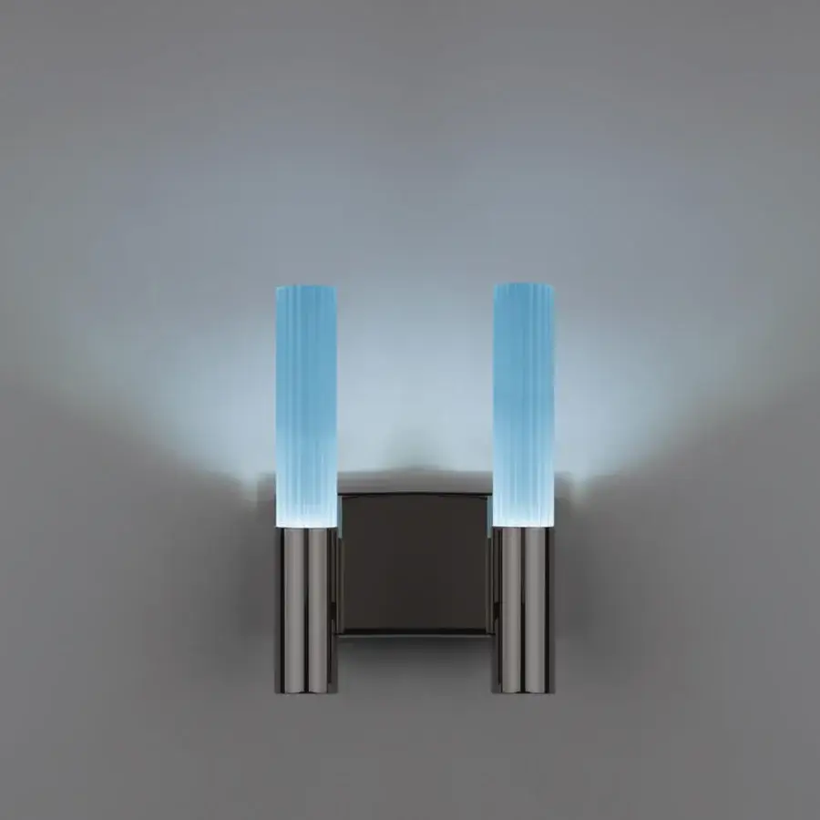 Elegant Euroluce Linea wall lamp crafted in metal with sculpted glass and satin finish casting a pale blue glow