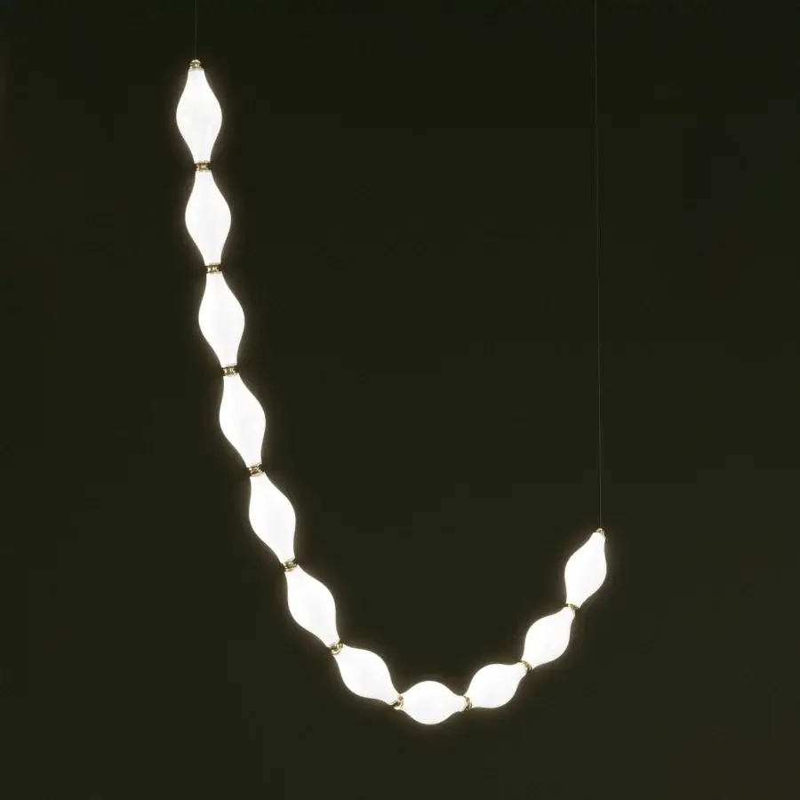 Captivating Euroluce Dewy suspension lamp with undulating form and radiant glow in white translucent material connected with gold-toned metal