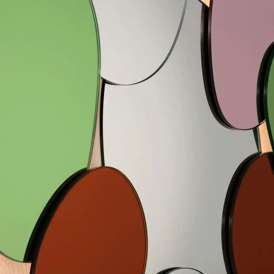 Superior Glas Italia Bouquet mirror with ten irregular ovoid glass shapes tinted in green, red, and lilac with a matte dark frame
