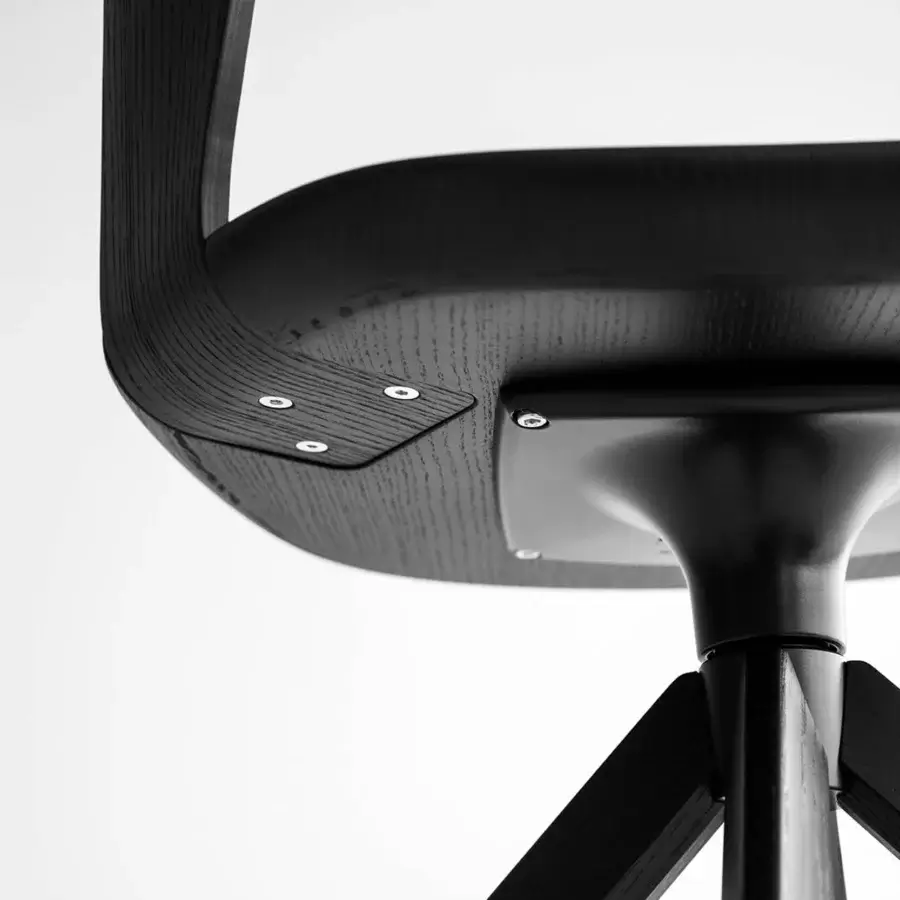 Superior Lapalma Arco chair with fully upholstered seat and curved plywood backrest in a dark muted black finish