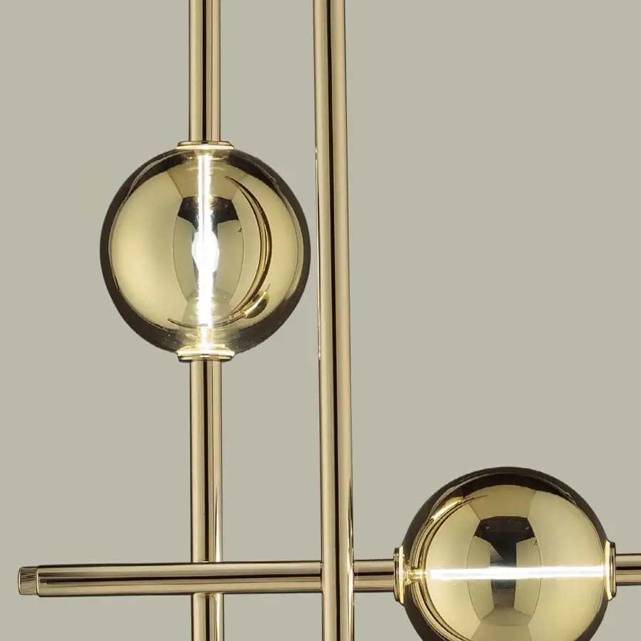 Distinguished Euroluce Mikado floor lamp crafted in polished brass with intersecting lines and spherical lampshades