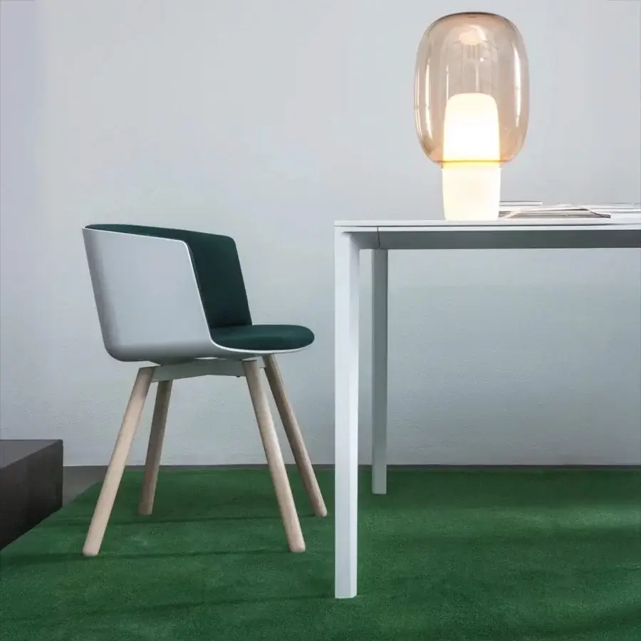 Distinguished Lapalma Cut armchair with gently curved Baydur shell, solid ash wood legs, light gray and dark teal coloring, satin finish